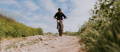 Rider on electric mountain bike on gravel path
