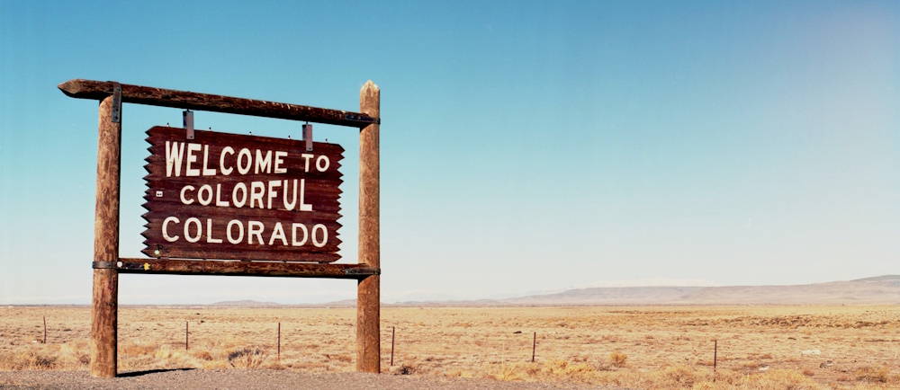 Photo by Kait Herzog on Unsplash of colorado sign