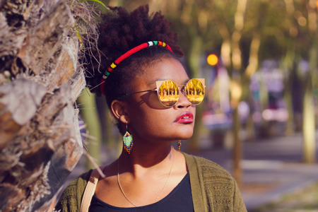 African Lady with Zulu Hairband on Her Afro Wearing Sunglasses.jpg