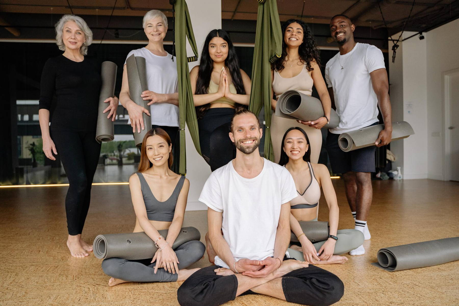 People practicing yoga with wellness products
