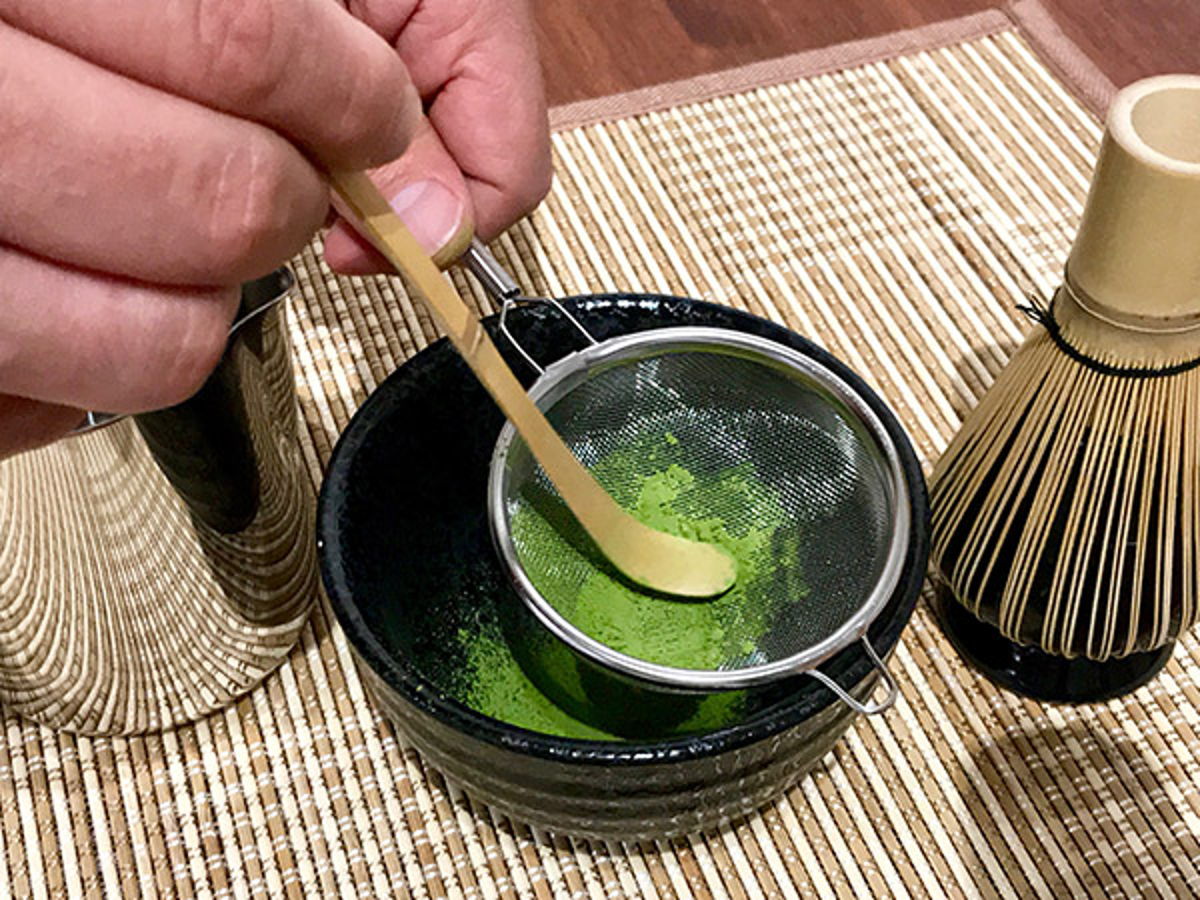 Push matcha through sieve with bamboo scoop