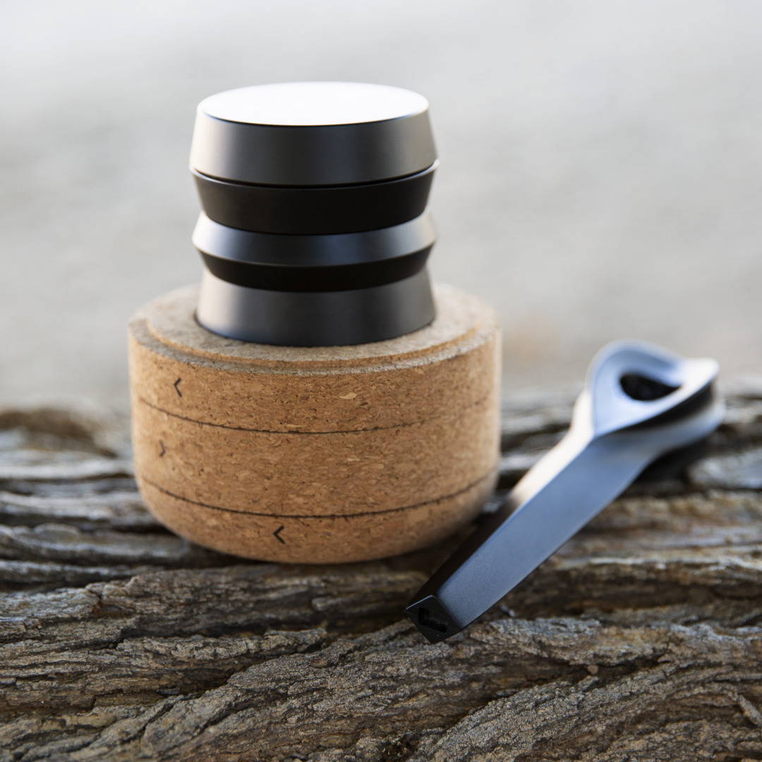 KLIP grinder over cork packaging and KOL pipe on the side