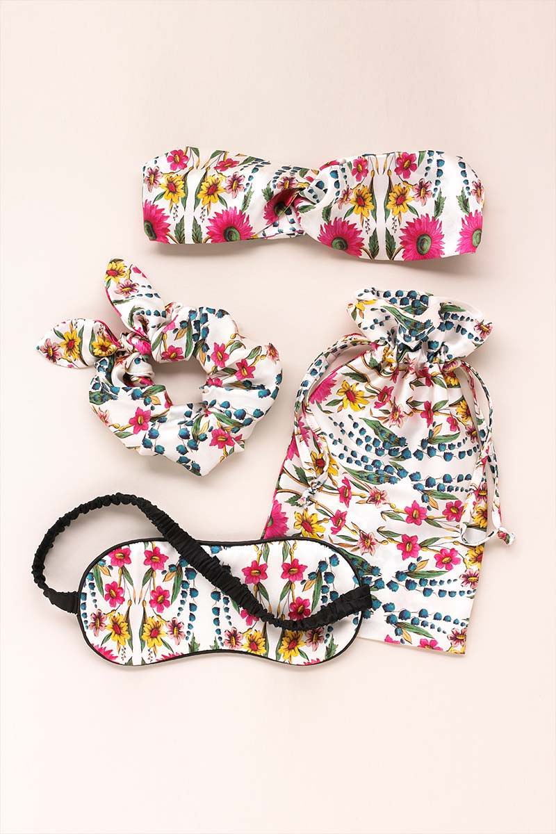 Perfect for sleepovers and trips away, The Wildflowers Ivory Silk Sleepover Kit includes a Silk Eyemask, Scrunchies and Headband which come in a matching silk pouch.