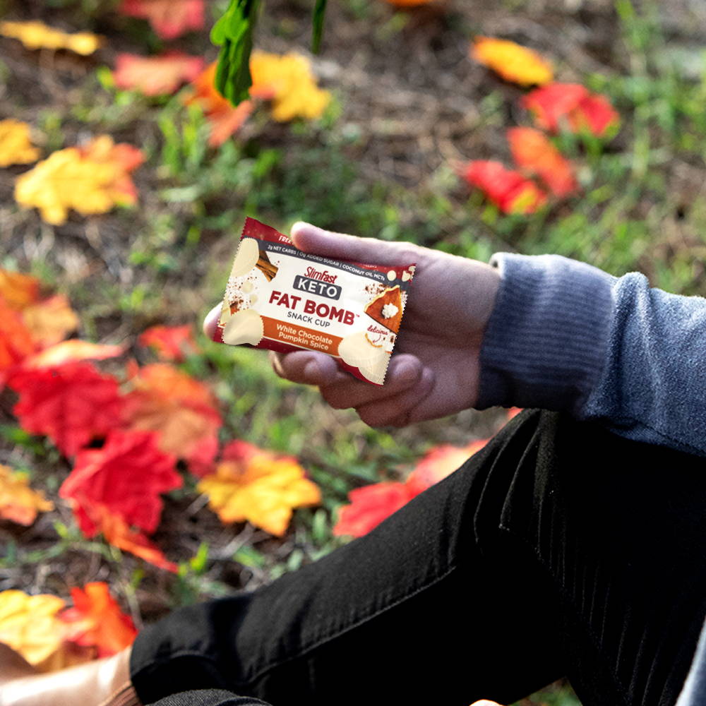 SlimFast Keto Fat Bomb White Chocolate Pumpkin Spice Snack Cup on the go, on a hike