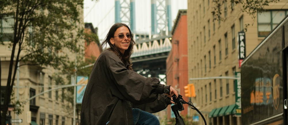 A woman on an electric bike in a city