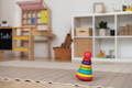 Montessori stacking toy in a playroom.