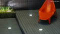 Close up shot of the uplighters embedded in the deck garden area