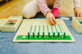 Kid playing and learning how to count