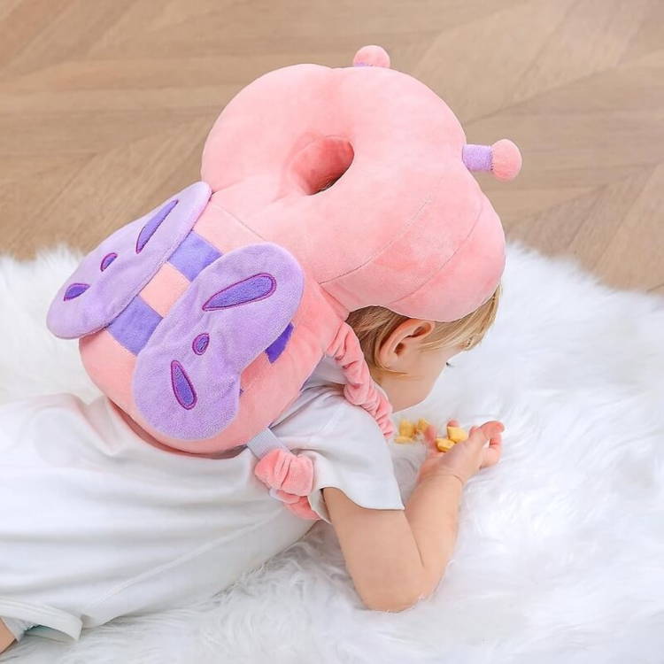 Little girl with a Montessori Baby Guardian soft backpack on her back.
