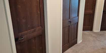 White Trim Doesn't Have to Match Your Wood Doors; In Fact, It Can Make Them Shine