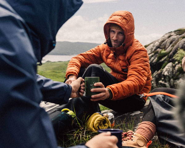 Man wearing insulated jacket from adventure-ready brand Finisterre
