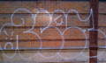 removing white graffiti from brick wall