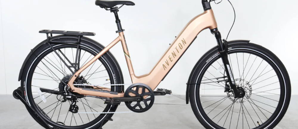 A peach Aventon Level 3 electric city bike