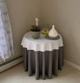 gray round tablecloth over a table