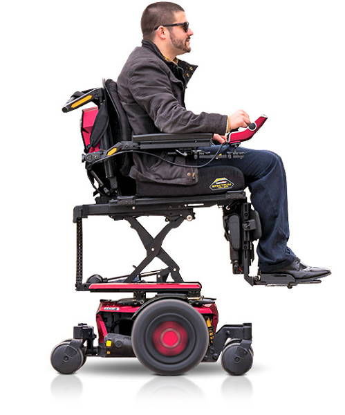 Man seated in a complex rehab power wheelchair with seat elevator raised