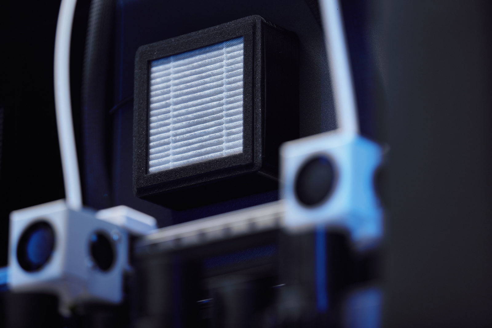 3D printed bracket in silver filament showing Dremel logo, printed on Dremel 3D45 printer