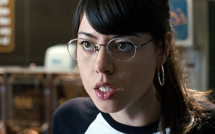 Aubrey Plaza as Julie Powers, looking intently in front, ready to start saying curse words.