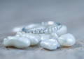 White pearl ring with hidden gems