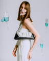 Model holding NOIRANCA handbag Debbie in Maya Blue