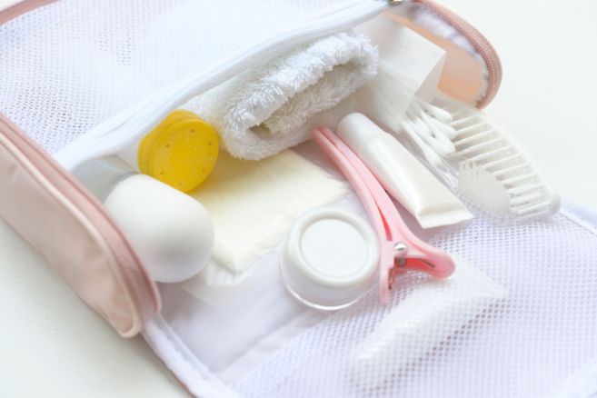 Shower set and towel in small bath bag.