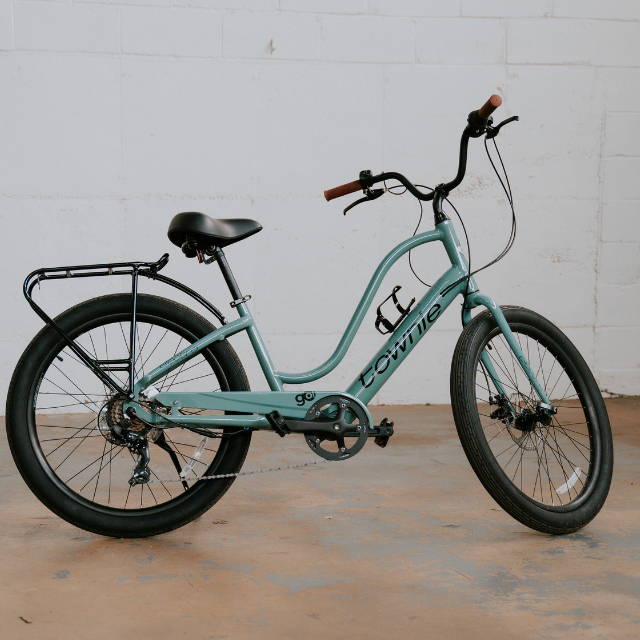 a teal Electra Townie electric cruiser bike