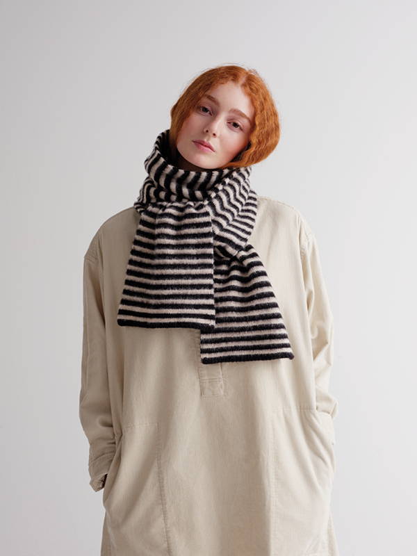 model wears  Brushed Narrow Stripe Scarf Black & Oatmeal
