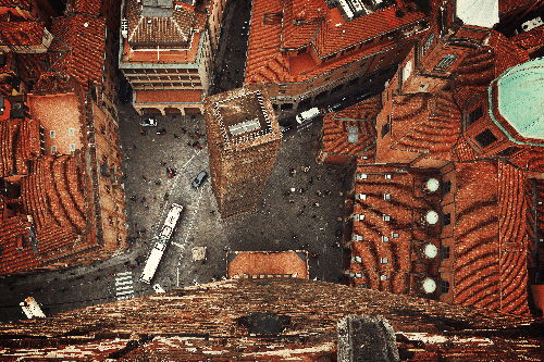 Photo of some Italian roofs, all distorted with a wave-like artefacts