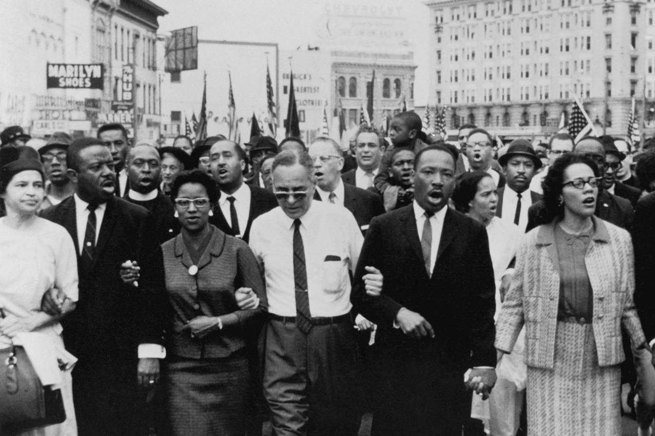 MLK marching with demonstrators, an important moment in black history