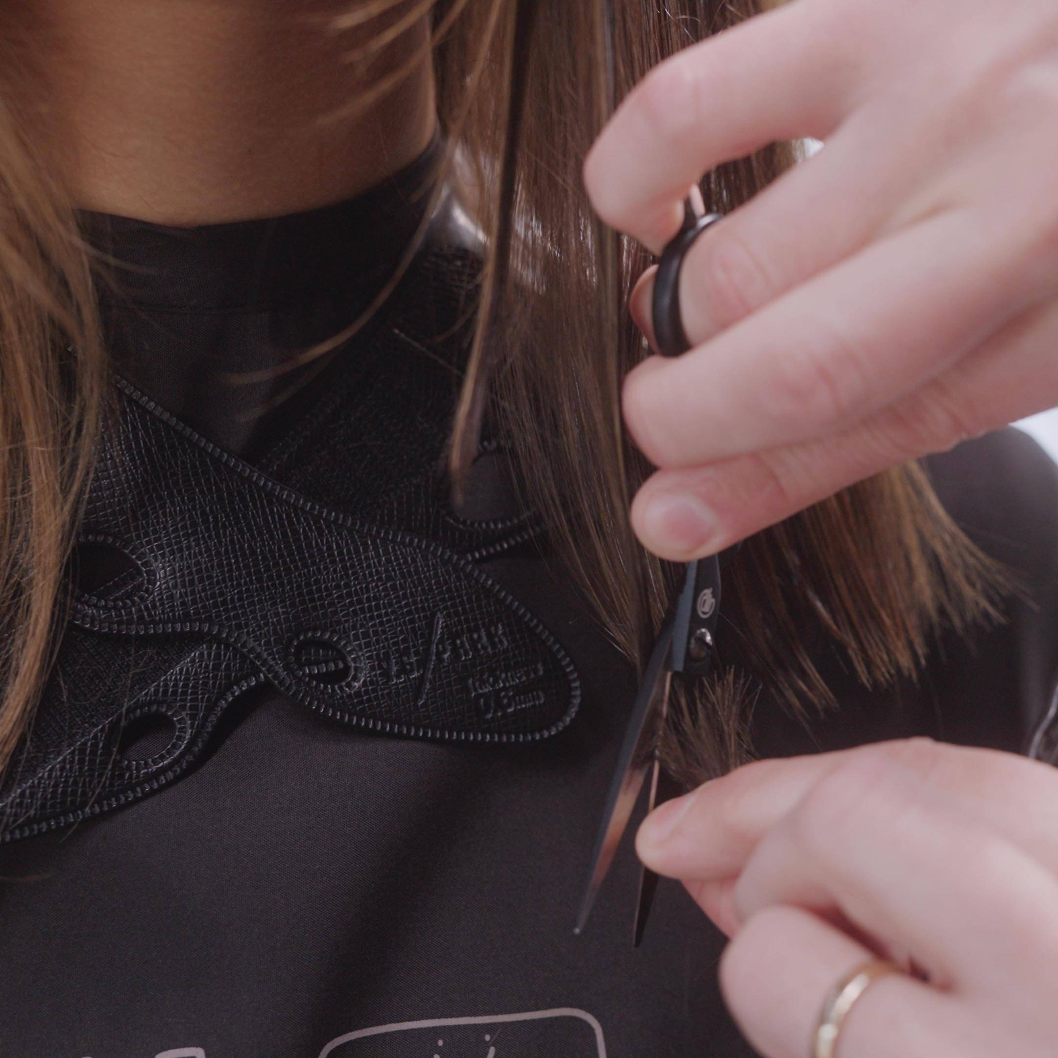 woman combing thin black hair
