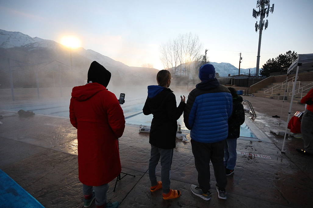 Small group by foggy pool