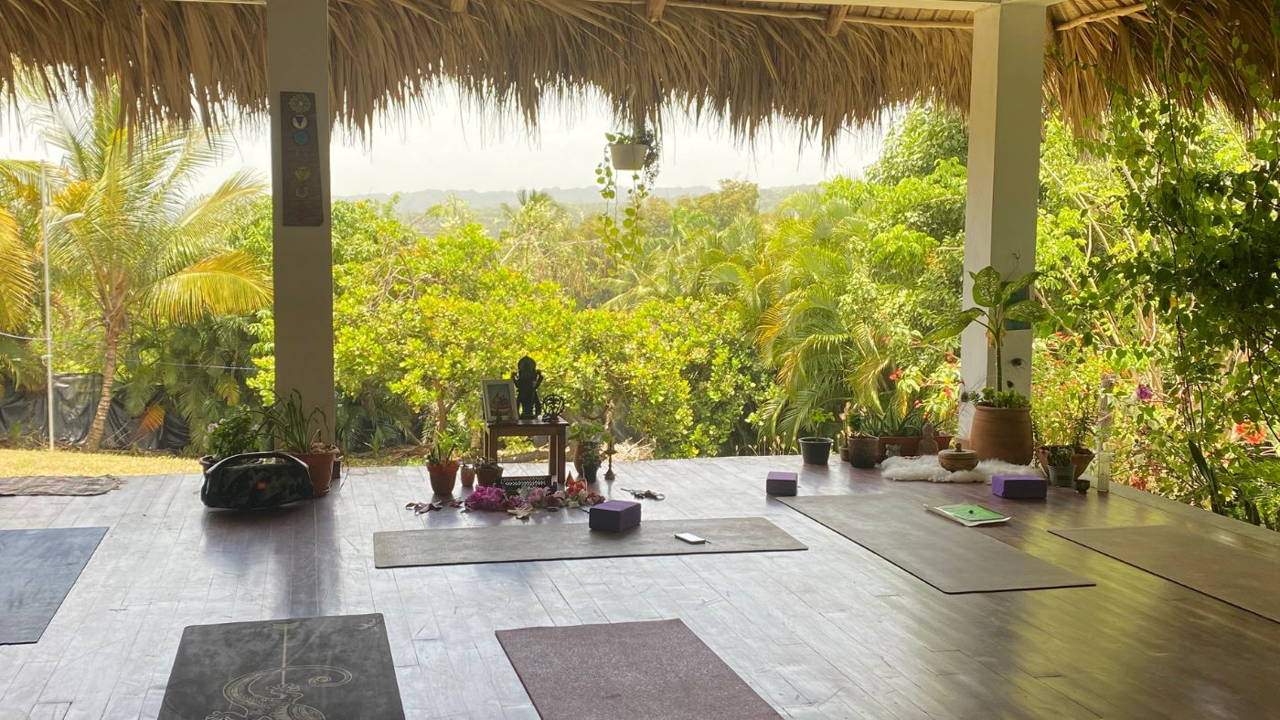 Dharma Shala Yoga Studio overlooking lush green mountains