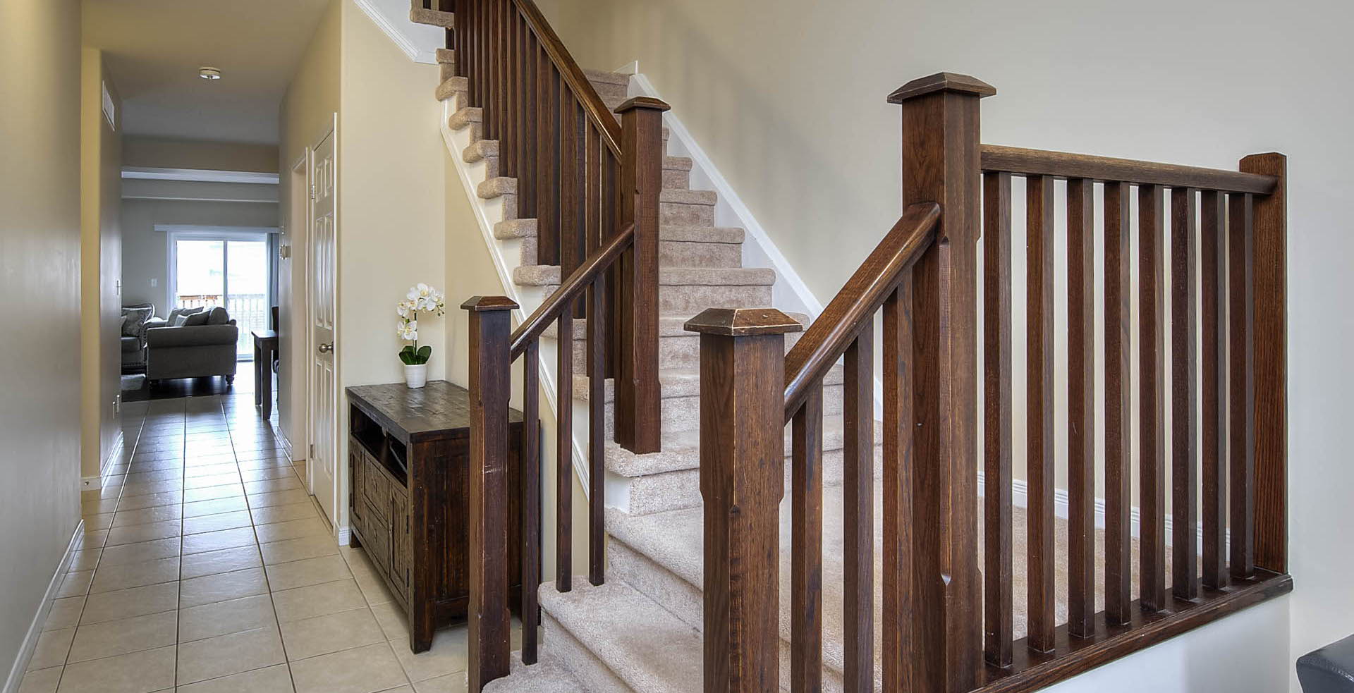 staircase with tile floors and natural light