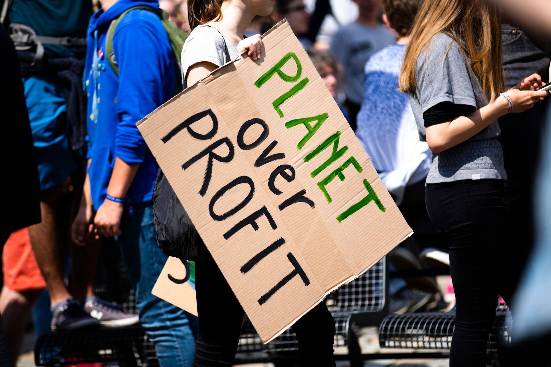 sign with planet over profit text