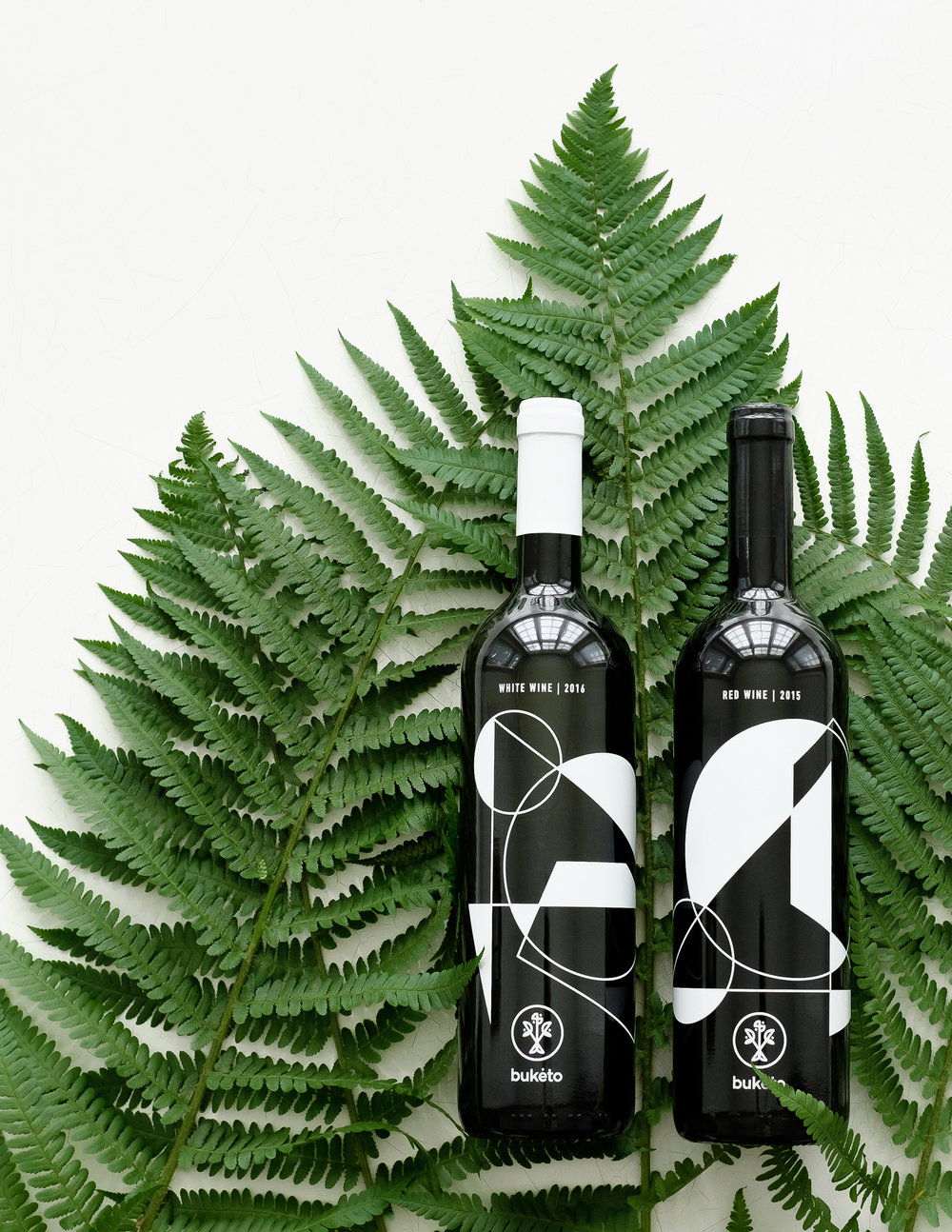 Buketo wine bottle designs by Lazy snail Design