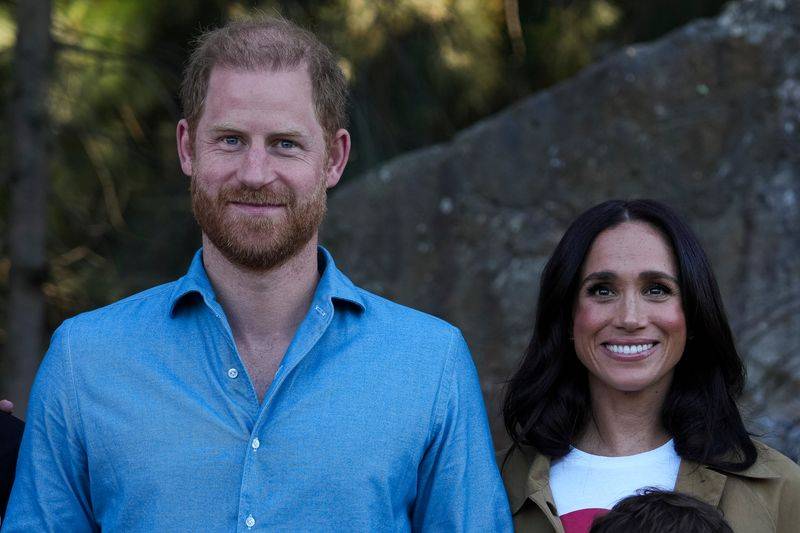 Image may contain: Prince Harry, Duke of Sussex, Face, Head, Person, Photography, Portrait, Happy, Smile, Clothing, and Shirt