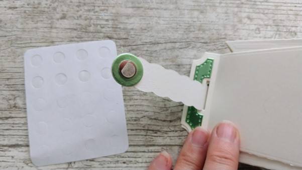 a hand holding a piece of paper
