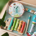 A colorful drum, xylophone, flute, and shakers featured in the Montessori Music Set.