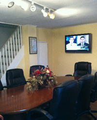 Creaky floors and flat screens: The downstairs conference room