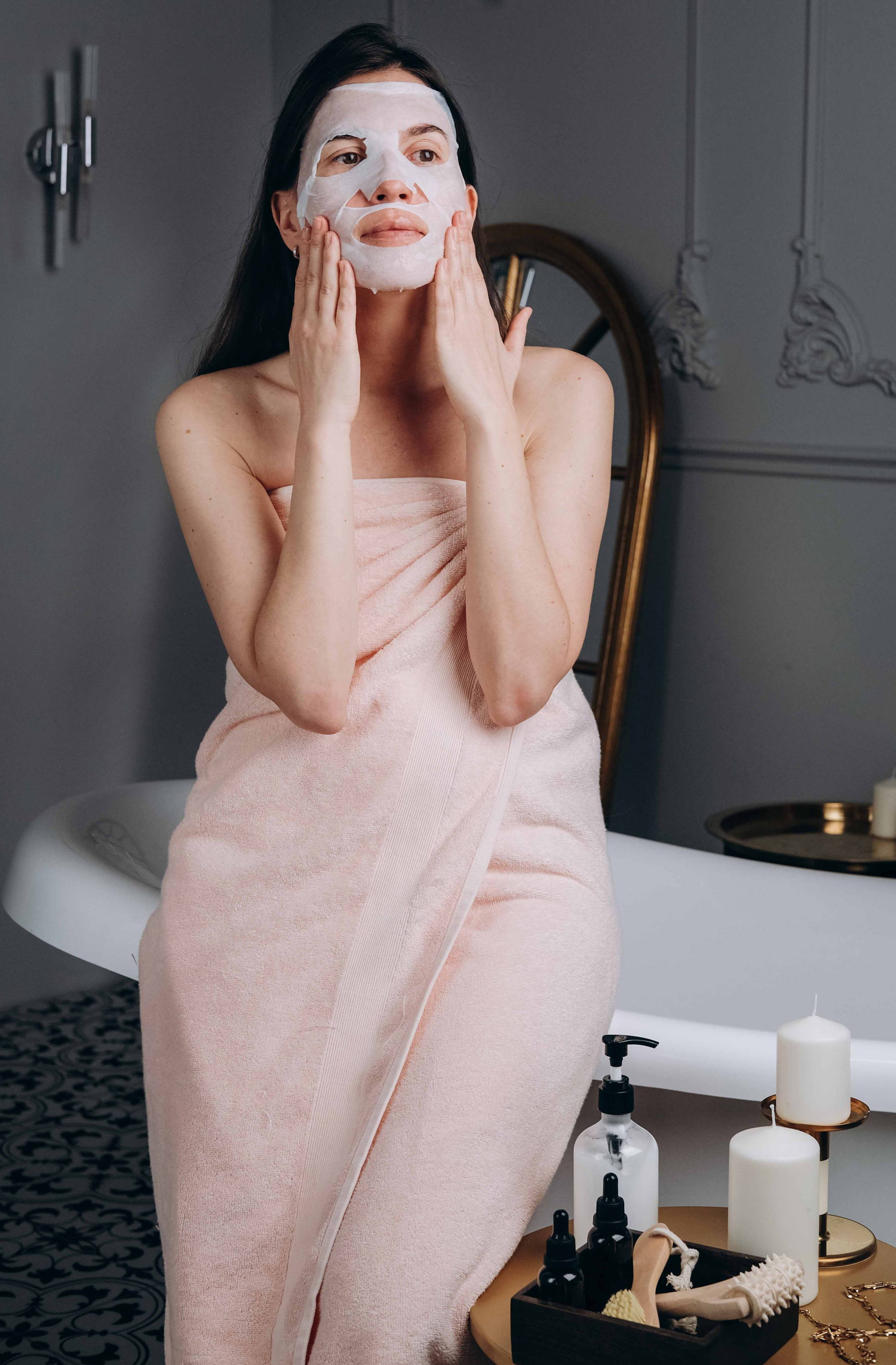 woman applying a face mask