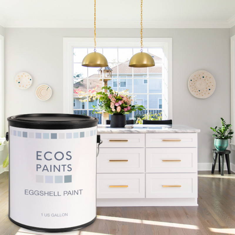 A can of Ecos Eggshell Paint superimposed in front of a contemporary kitchen