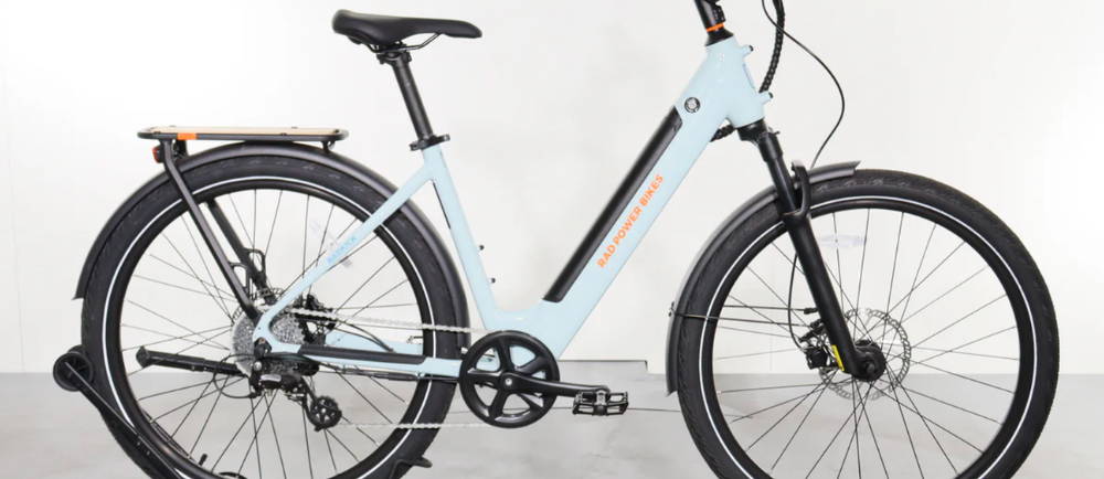 A light blue Rad Power Bikes RadKick 7-Speed electric city bike