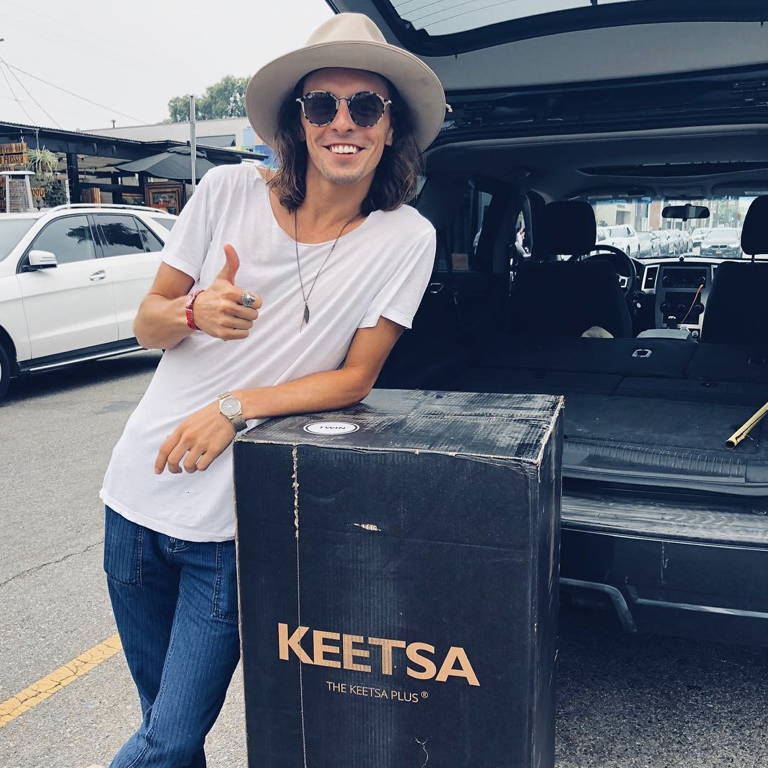 A guy thumbs up with Keetsa mattress.