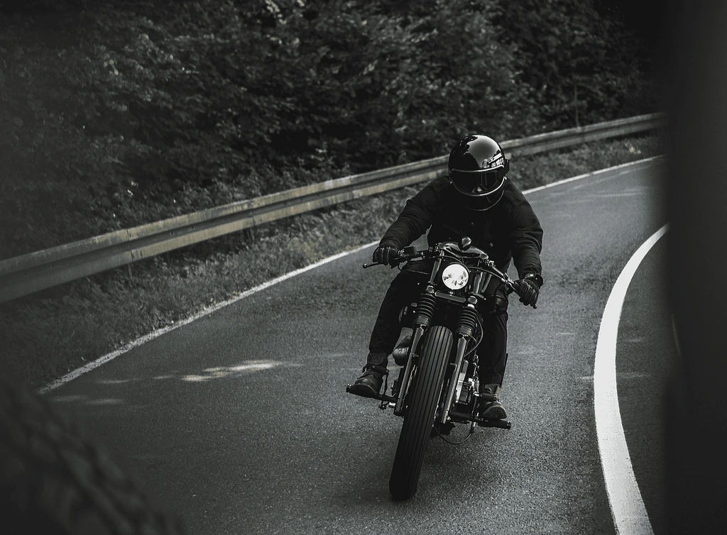 Motorcyclist riding on a curved road