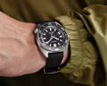 Black rubberstrap and black dial Seiko Prospex on a man wrist