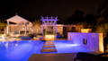 Pool lighting, step lighting and landscape lighting working together to define the outdoor entertaining area, creating depth, contrast and visual impact after dark.