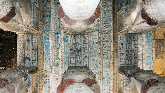 Colored frescoes on the ceiling of an ancient temple of Hathor