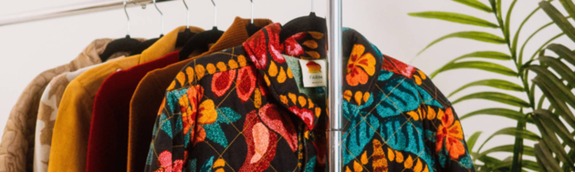 Beautiful clothing on rack - Link to join Armoire Clothing Rental