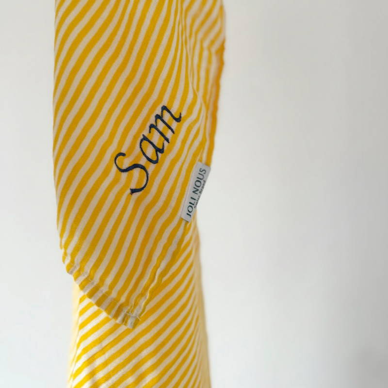 Lange XL et mini élégant de la marque suisse Joli Nous, un accessoire premium pour bébé, alliant design raffiné et qualité exceptionnelle