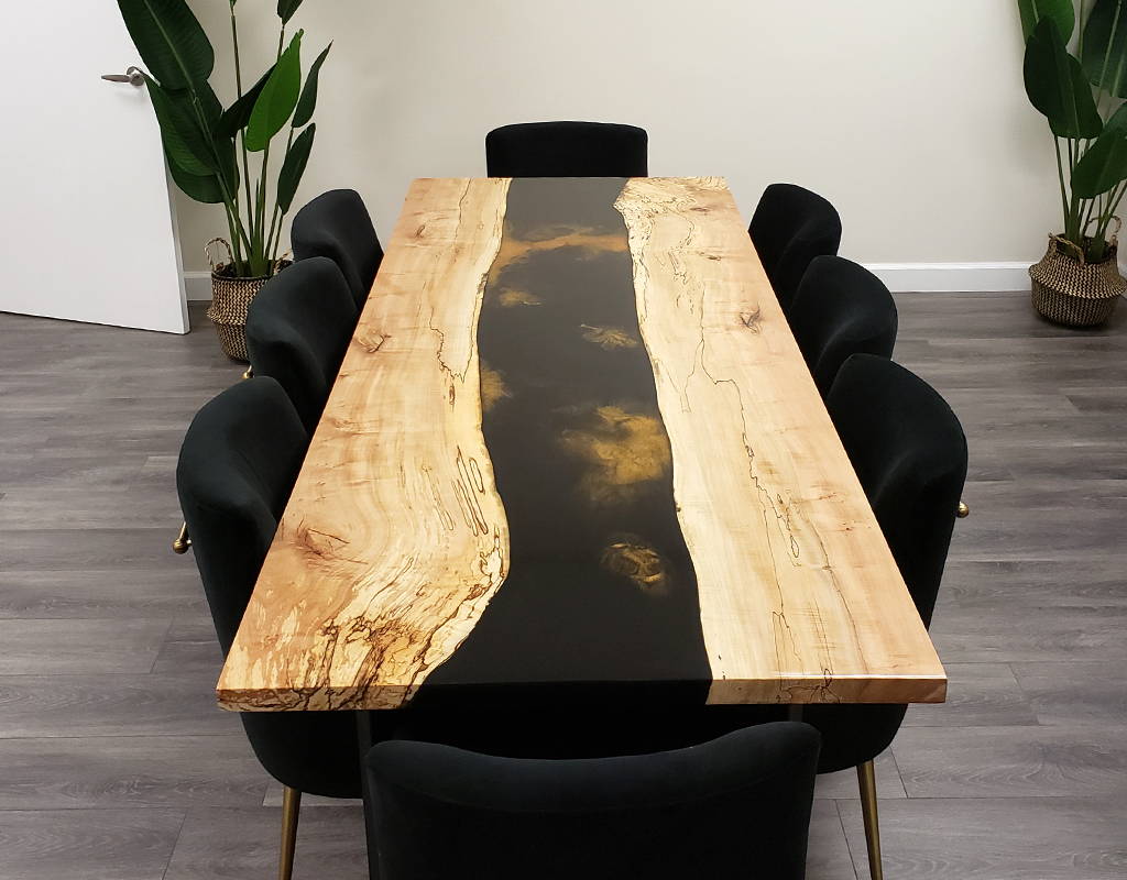 black and gold live edge epoxy river table