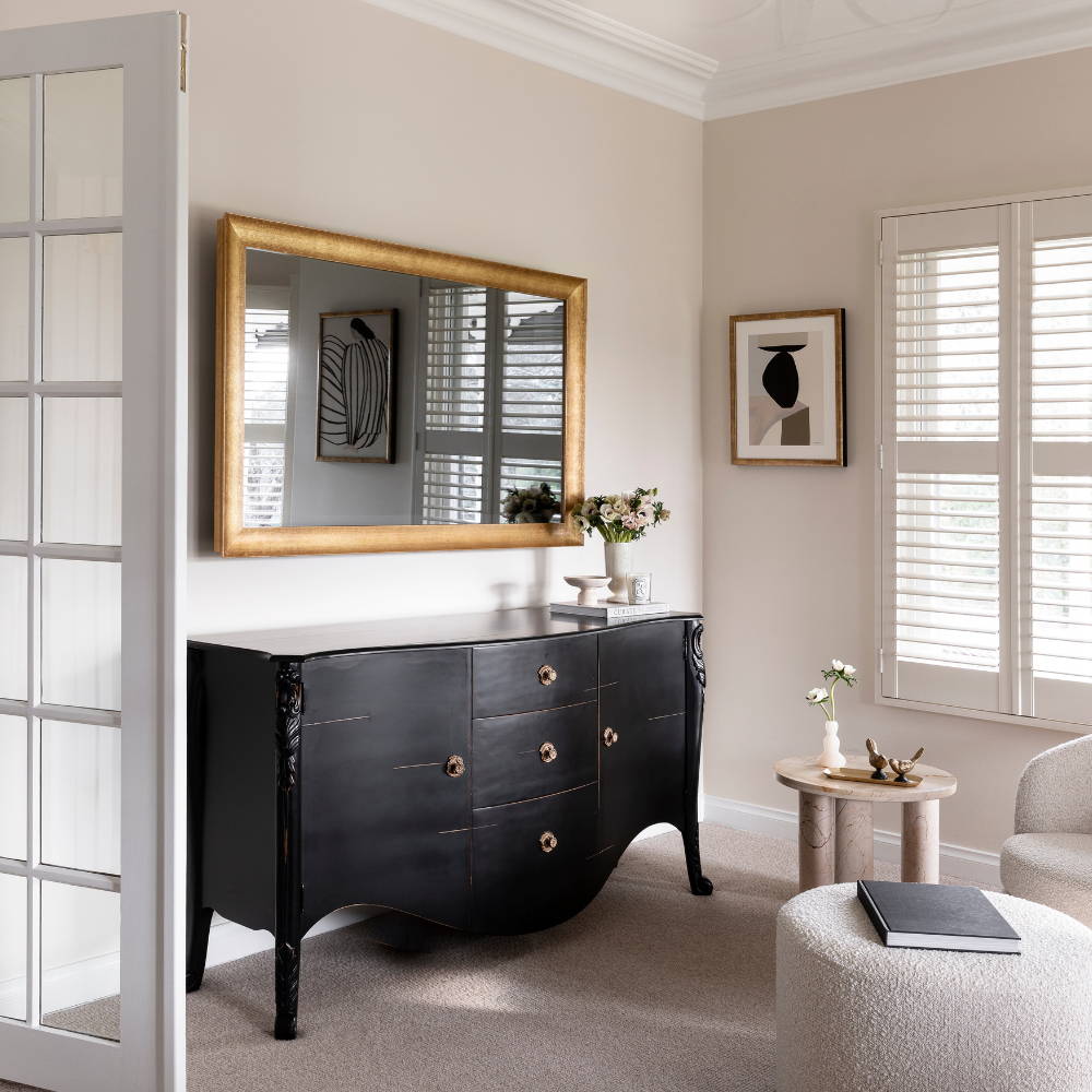 TV-Mirror in Gold Leaf Frame by FRAMING TO A T - A formal lounge setting with a gold leaf frame on a TV-Mirror